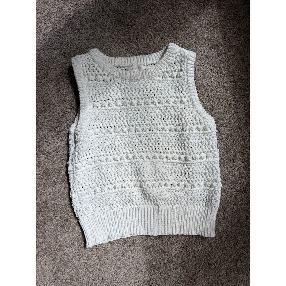 Greige white/ivory sleeveless crochet knit sweater vest featuring an open-knit